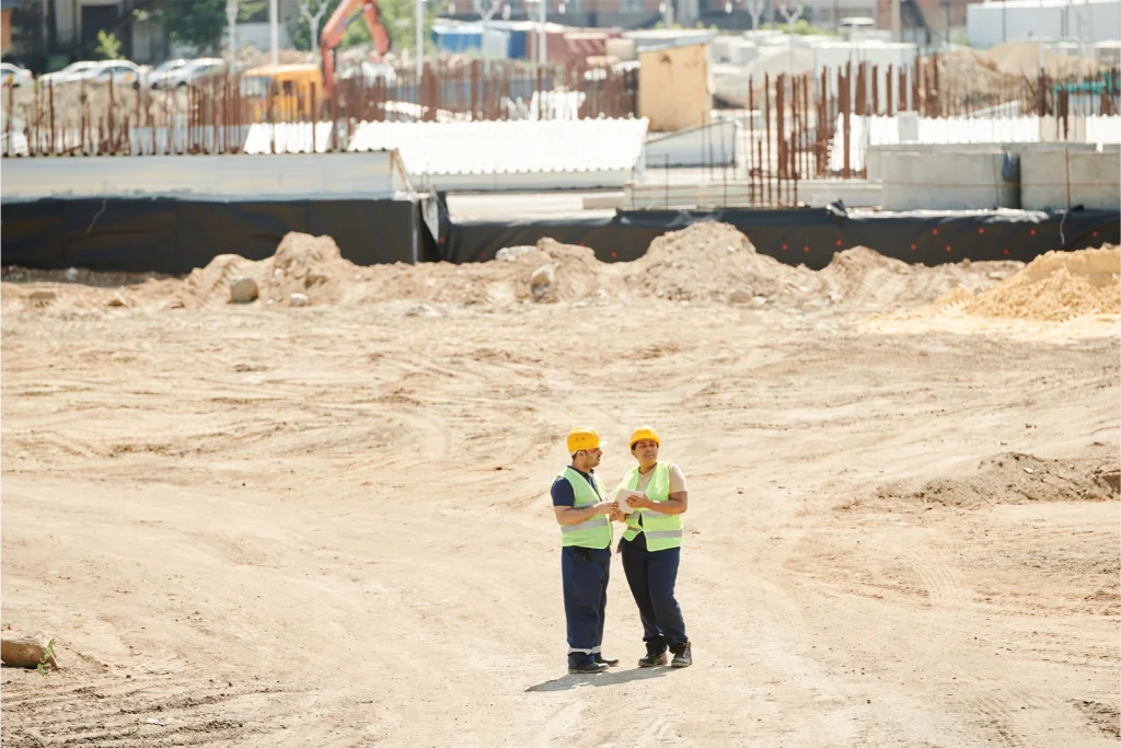 construction-supervisors-reviewing-large-jobsite Construction supervisors reviewing a large jobsite