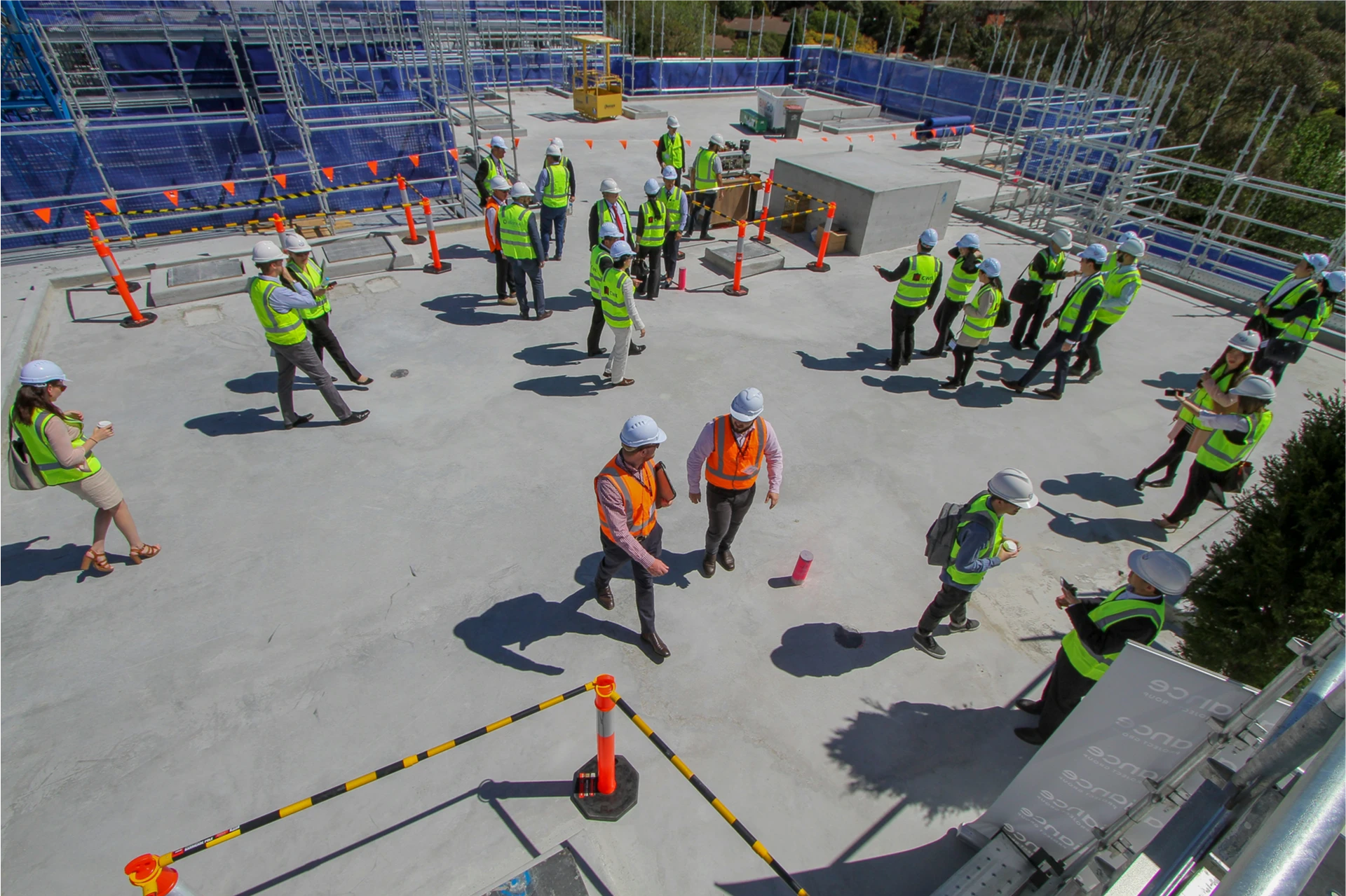 construction-team-reviewing-active-jobsite Construction team reviewing an active jobsite
