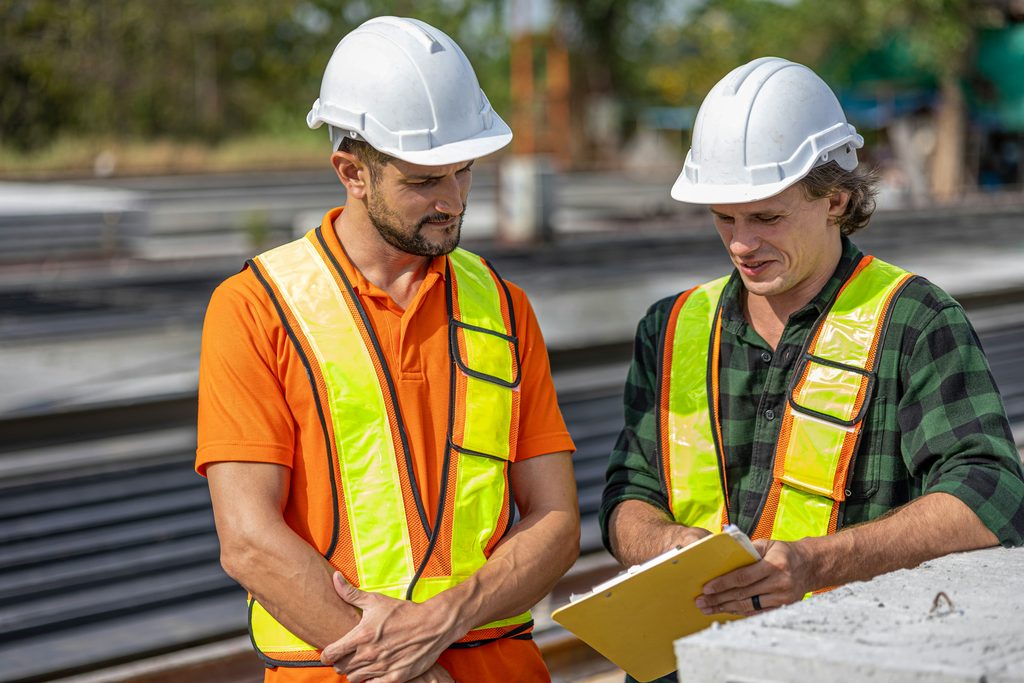 construction-workers-reviewing-safety-notes